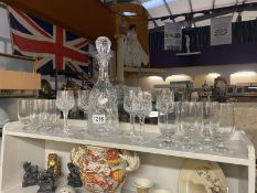 A cut glass decanter & a quantity of glasses