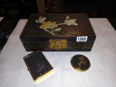 A vintage oriental lacquered box, cigarette case/lighter & powder comport