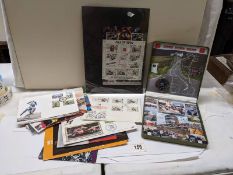 An interesting collection of Isle of Man TT race stamps ephemera, £5 coin, coin covers, signed cover