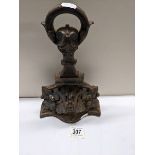 A cast iron door stop.