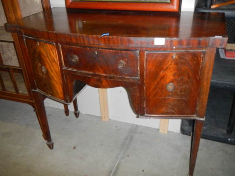 A small Victorian mahogany bow front sideboard.