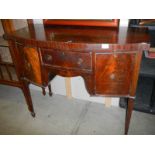 A small Victorian mahogany bow front sideboard.