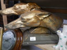 A signed sculpture of two greyhound heads. COLLECT ONLY.