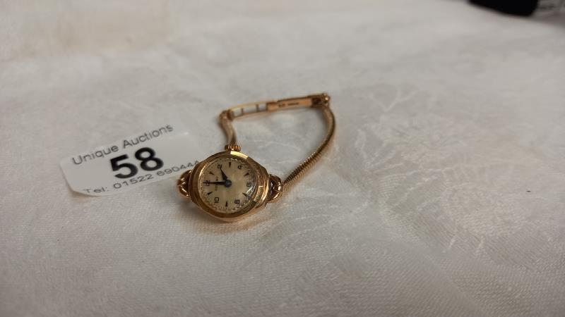 A 9ct gold vintage ladies wrist watch, total weight 14.8 grams.
