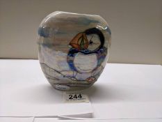 A Lise B Moorcroft vase featuring puffins, dated 2011.