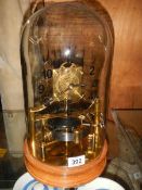 A late 20th century electric magnetic hip toggle great balance wheel clock, will need new batteries