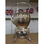 A good quality silver plate kettle on stand complete with burner.