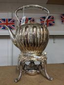 A good quality silver plate kettle on stand complete with burner.