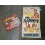 A rare welsotoys, the flintstones bowling alley, and colour by numbers book.