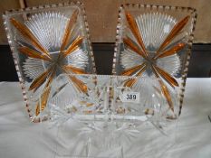 Two overlaid glass dressing table trays and one other.