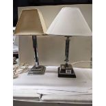 Two vintage chrome table lamps with shades.