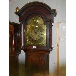 A good eight day long case clock with brass arched dial