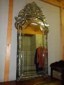 A large engraved gypsy style mirror.