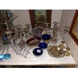 A quantity of silver plate including glass lined bowls & pair of candelabra etc.