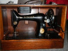 A cased Singer sewing machine.