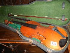 A cased violin and bow.