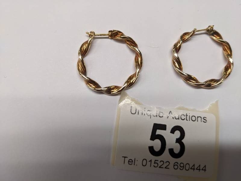 A pair of 9ct gold twisted design hoop earrings, 2.3 grams. - Image 4 of 4