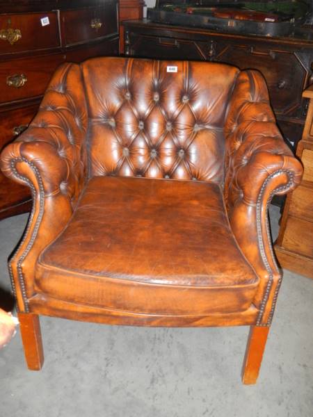 A good quality tan leather deep buttoned arm chair. COLLECT ONLY.