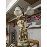 A double light figural table lamp. COLLECT ONLY.