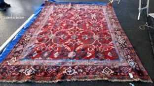 A large red patterned carpet - 330cm x 240cm (COLLECT ONLY)