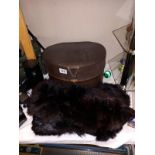 An old hat box of fur stoles etc.