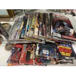 A qty of Transformers comics , some with free gifts.