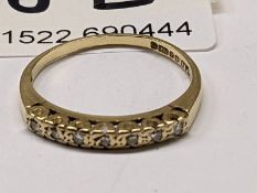 An 18ct gold ring set diamond chips, size N half, 2.2 grams.