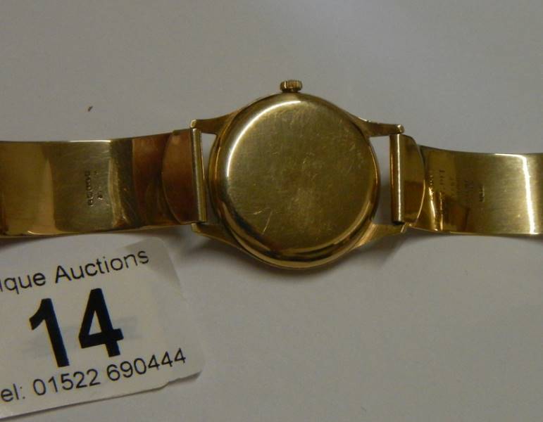 A 9ct gold Omega wrist watch on a 9ct gold bracelet, in working order. 36 grams total weight. - Image 3 of 4