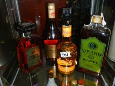 Four bottles of spirits including brandy