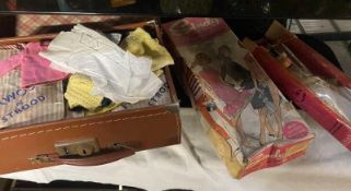 A vintage boxed Sindy Doll & others & a case of clothing