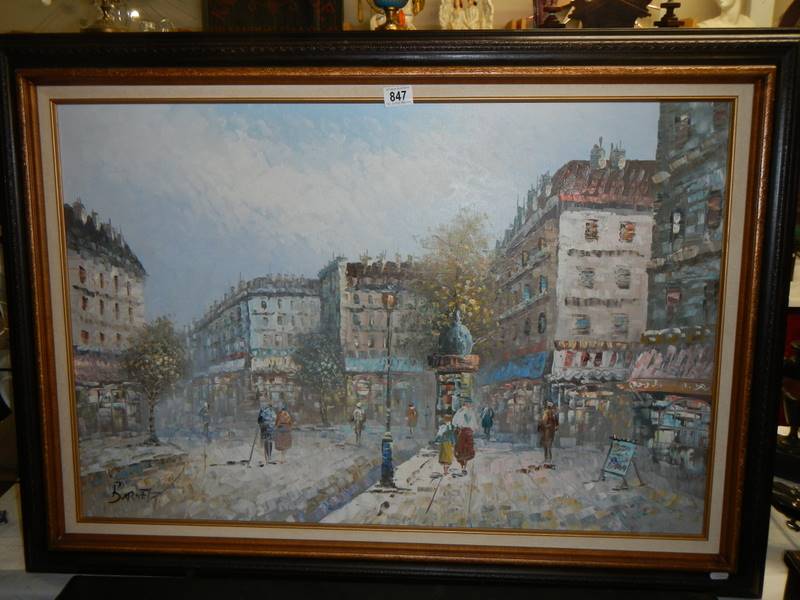 An oil on canvas continental street scene.