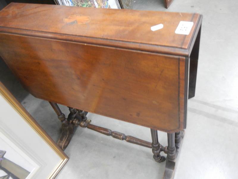 A small mahogany Sutherland table a/f.