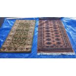 A green patterned rug - 150cm x 80cm & 1 other rug - 90cm x 165cm (COLLECT ONLY)