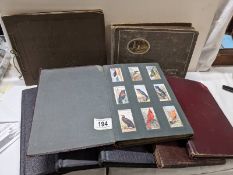 A good selection of cigarette cards in albums.