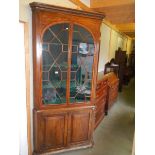 A large Victorian glazed top door corner cupboard.