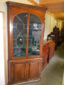 A large Victorian glazed top door corner cupboard.