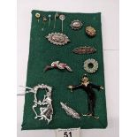 Nine vintage brooches and four stick pins, Victorian to 1960's including silver and gold examples.