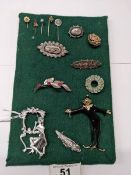Nine vintage brooches and four stick pins, Victorian to 1960's including silver and gold examples.