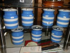 Seven T G Green storage jars.