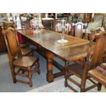 A superb quality draw leaf banqueting table with eight dining chairs, 275 cm closed, 322 cm open.