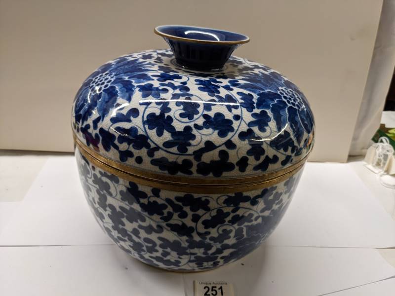 A large Chinese lidded pot with metal fittings, Shun-Chih.