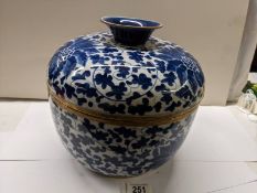 A large Chinese lidded pot with metal fittings, Shun-Chih.