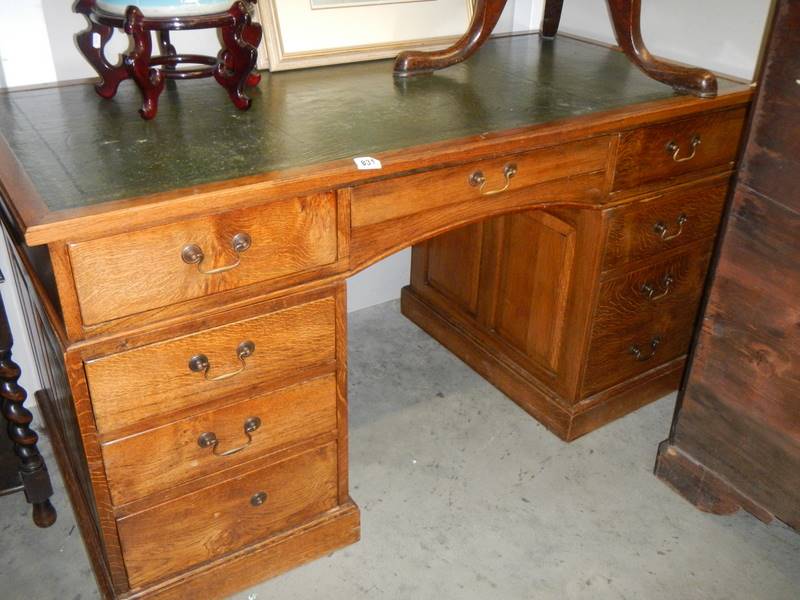 A double pedestal desk with green leather top, COLLECT ONLY.