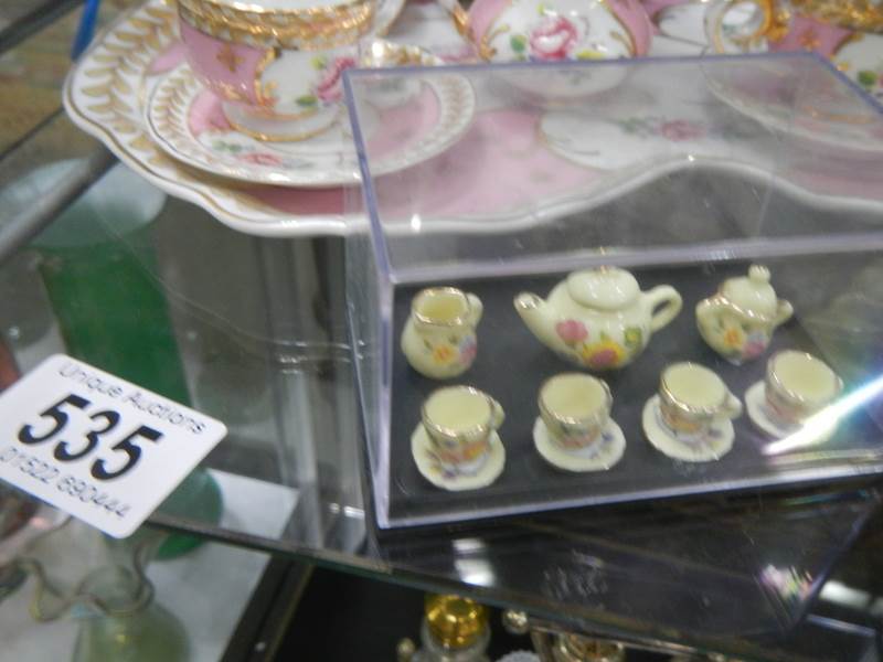 A miniature tea set and one other. - Image 3 of 3