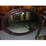 An oak framed bevel edged mirror, COLLECT ONLY.