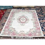 A pink & beige coloured patterned rug - 46 inches x 68 inches (COLLECT ONLY)