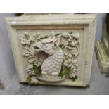 A square garden wall plaque featuring a dragon. COLLECT ONLY.