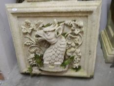 A square garden wall plaque featuring a dragon. COLLECT ONLY.