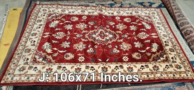 A red/brown coloured carpet - 106 inches x 71 inches (COLLECT ONLY)