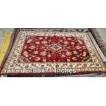 A red/brown coloured carpet - 106 inches x 71 inches (COLLECT ONLY)